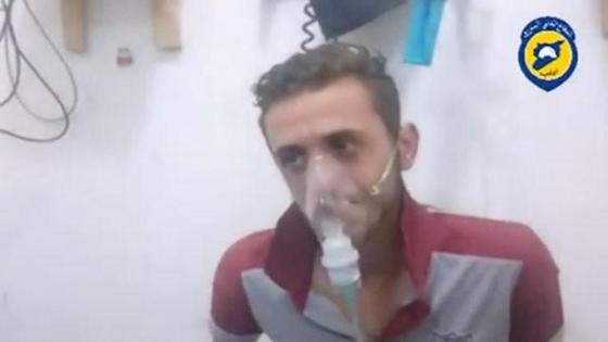 A still image taken on August 2, 2016 from a video said to be taken on August 1, 2016 posted on social media shows a man sitting breathing through a mask in what is said to be in Saraqeb, Idlib province, Syria. Social Media/Handout via Reuters Tv