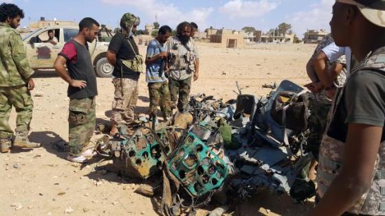 Libyans gather around the remains of a helicopter that crashed near Benghazi, Libya July 20, 2016. REUTERS/Stringer